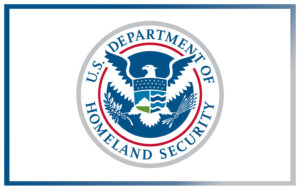 U.S. Department of Homeland Security seal featuring an eagle, shield, and the department name in a circular design on a white background.